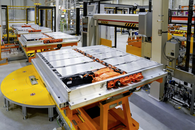 View of multiple battery cells in a factory hall