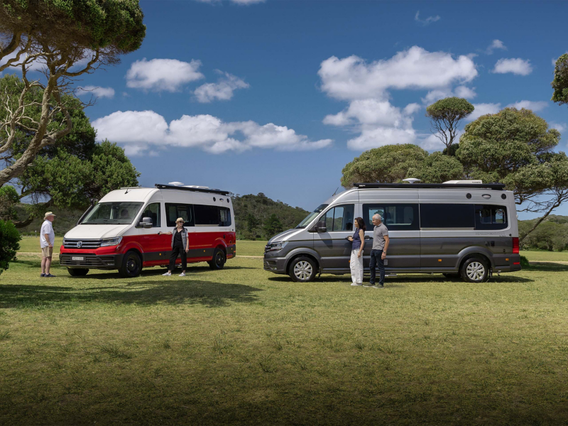 Two Crafter Kampervans parked in a field