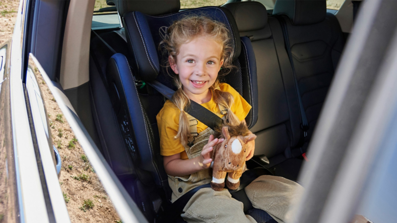 Child safely seated in car