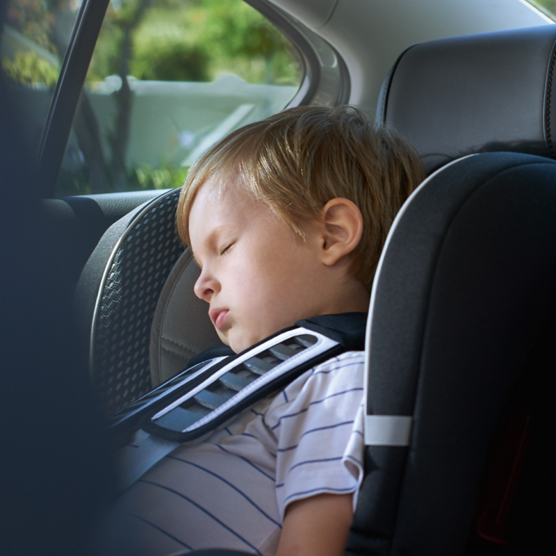 Child sleeping in infant seat