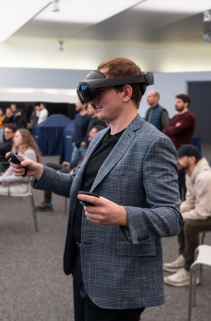 Young student with VR glasses and controllers