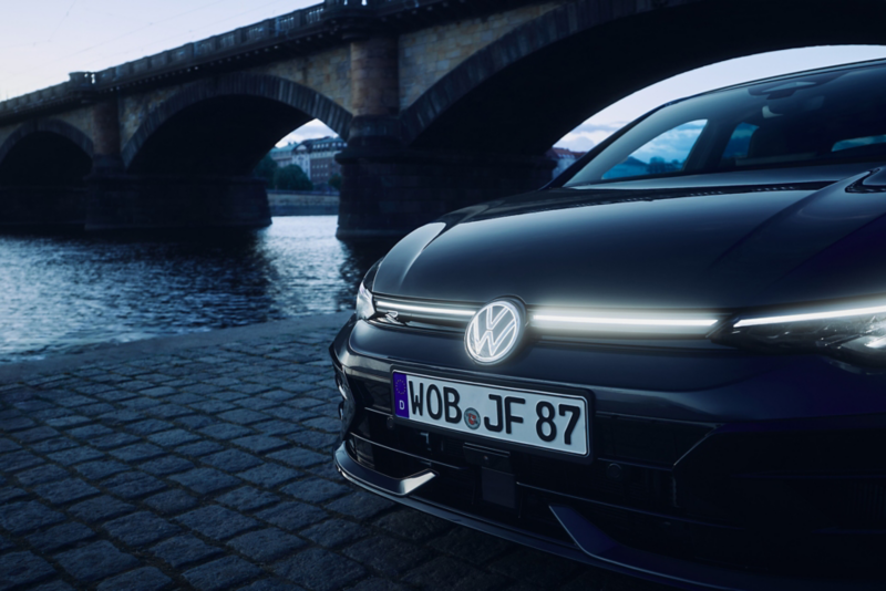 A blue VW ID. Polo from an angled front view against a light blue background.