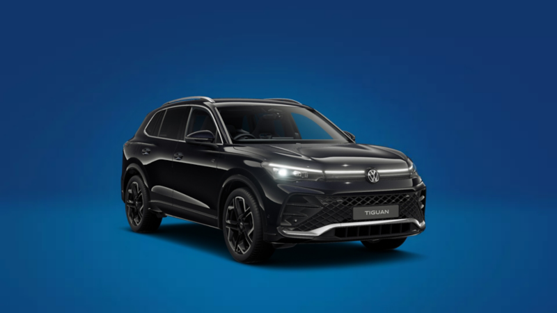 A front 3/4 shot of a black Volkswagen Tiguan R-Line on a blue background