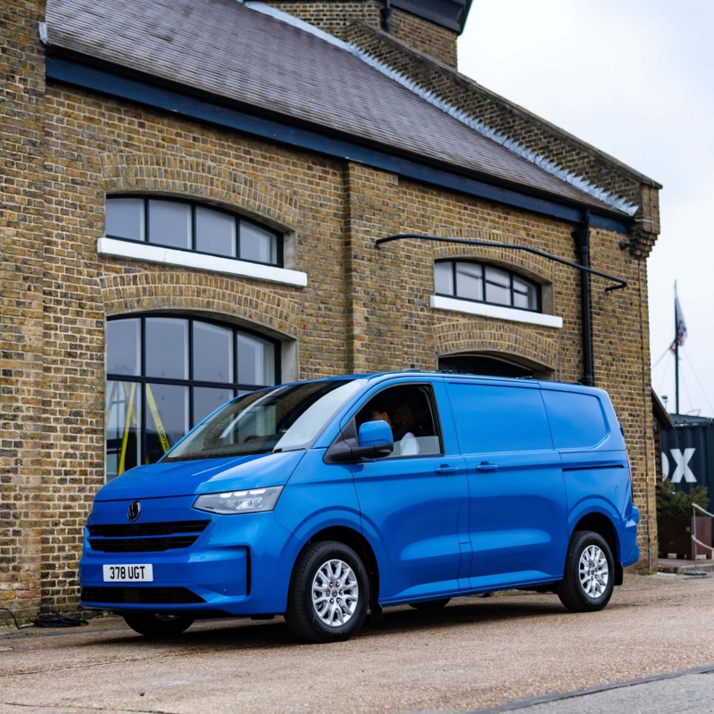 Photo showing a VW Transporter parked next to a warehouse building.