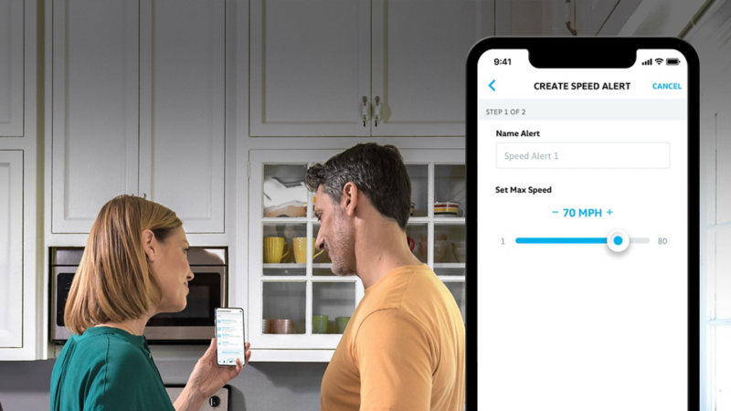 Couple using the Car-Net® app to view alerts