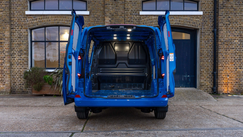 the back doors of the Transporter are opening showing the amount of space in the boot