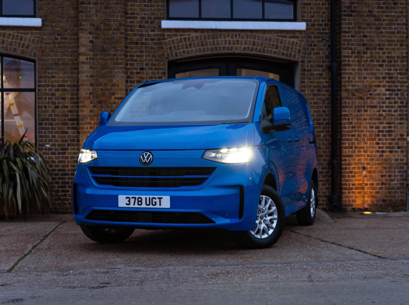 VW Transporter driving out of a warehouse entrance. 