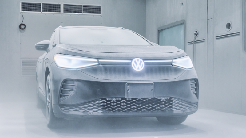 A frosty Volkswagen ID.4 with headlights on in a freezing cold bunker