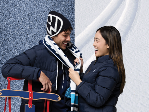 A couple wearing very warm VW jackets.