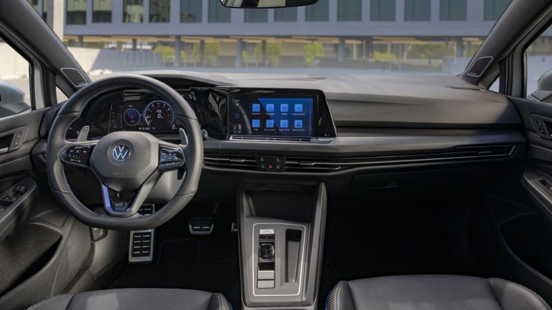 Interior of a 2024 Volkswagen Golf R, featuring a modern dashboard, steering wheel, and comfortable seating.