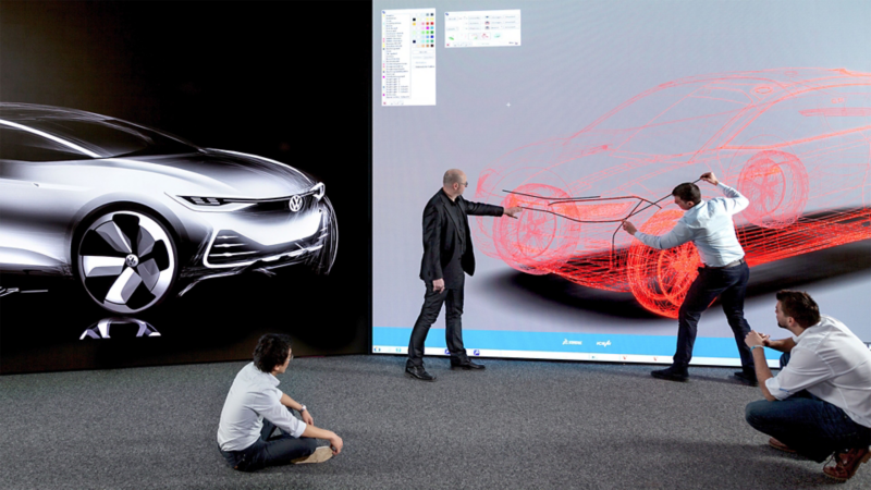 Four colleagues working on a virtual VW vehicle design