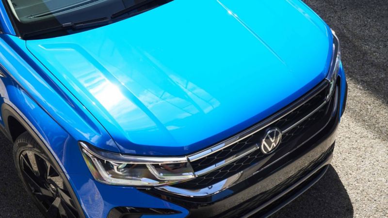 Birds eye view and a close-up of a blue VW SUV