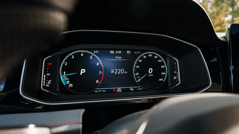 Close-up of the 2025 VW Jetta GLI's digital cockpit, highlighting the vehicle's dashboard and controls.