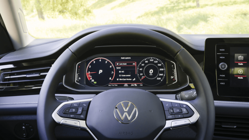 Close-up of the 2026 Volkswagen Jetta Digital Cockpit Pro displaying driving assist options.