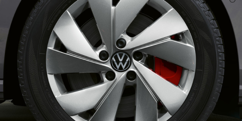 Close-up of a sleek Volkswagen alloy wheel and tire.
