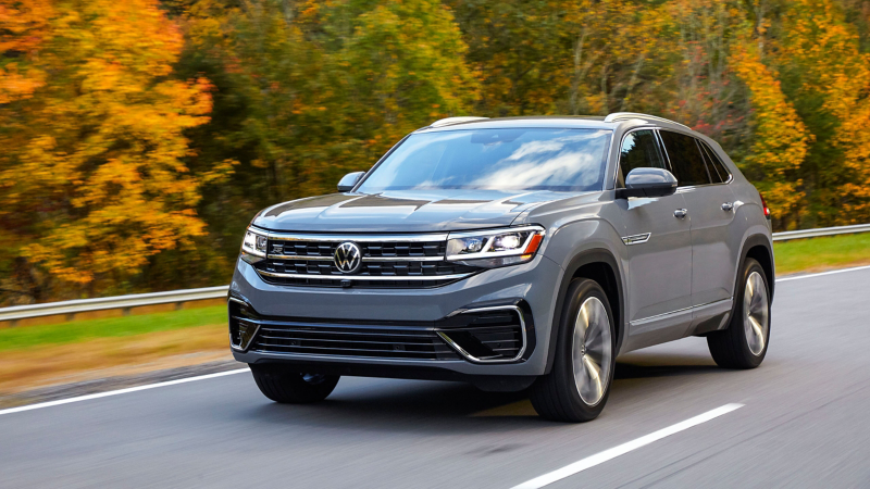 The 2022 Volkswagen Atlas Cross Sport driving down a roadway.