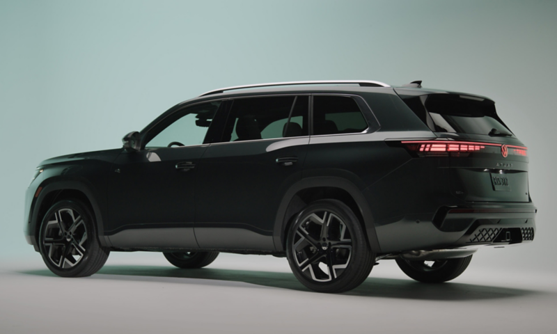 Rear view of an Atlas shown in Sacramento Green Metallic parked in a studio setting.