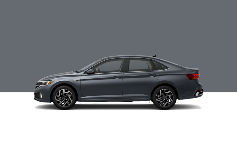 Driver’s side profile view of a Platinum Gray Metallic Jetta.