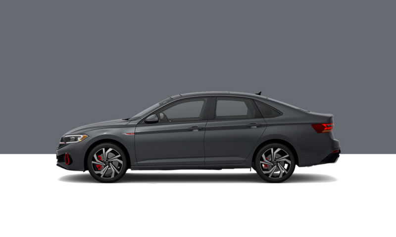 Driver’s side profile view of a Pure Gray Jetta GLI.