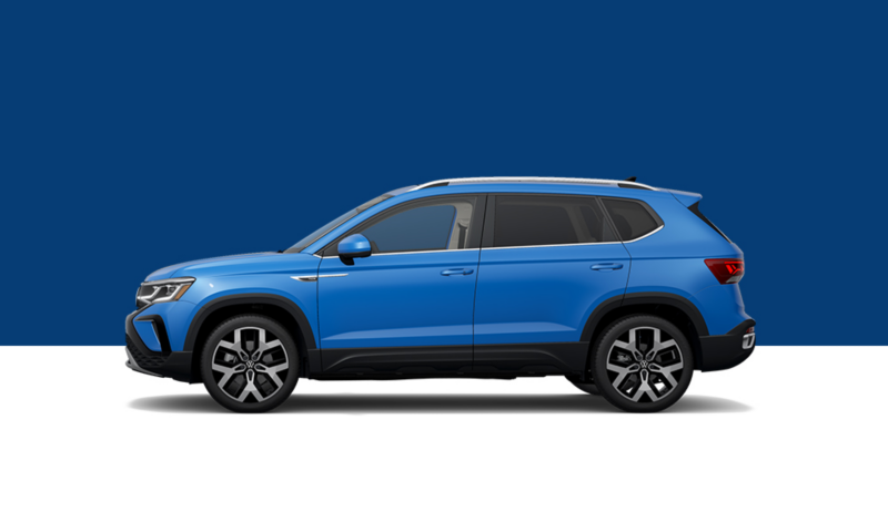Driver’s side profile view of a Cornflower Blue Taos.
