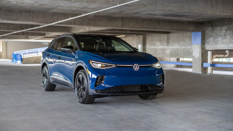 Frontal 3/4 image of ID.4 in Mountain Lake Blue Metallic parked on a industrial setting