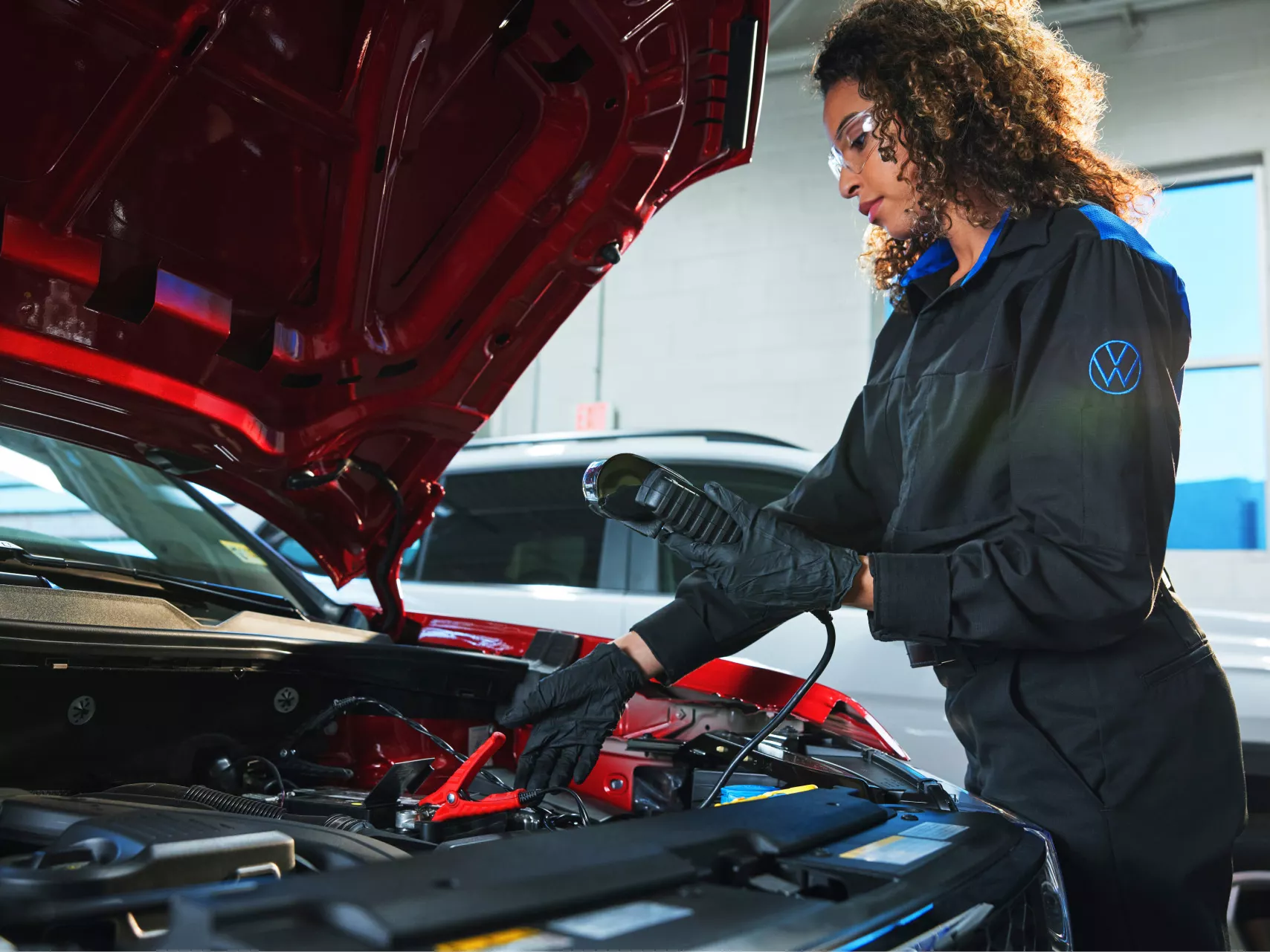 Volkswagen Mechanic testing car battery