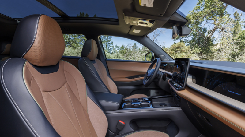 Interior view from the front passenger side of an Atlas Cross Sport looking across the interior, seats and dash.