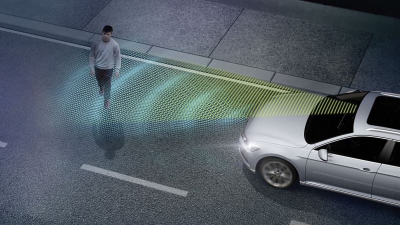 Depiction of Volkswagen IQ.Drive feature Front Assist detecting a pedestrian in the road. 