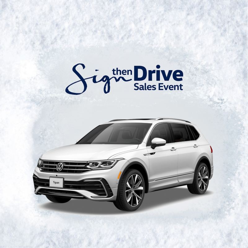 A front ¾ profile view of the Tiguan shown in Opal White on a light gray textured background with text ‘Sign then Drive Sales Event’ above.