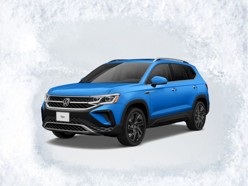 A front ¾ profile view of the Taos shown in Cornflower Blue on a light gray textured background with text ‘Sign then Drive Sales Event’ above.