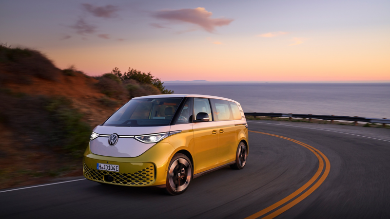 The Volkswagen ID.Buzz driving down a roadway.