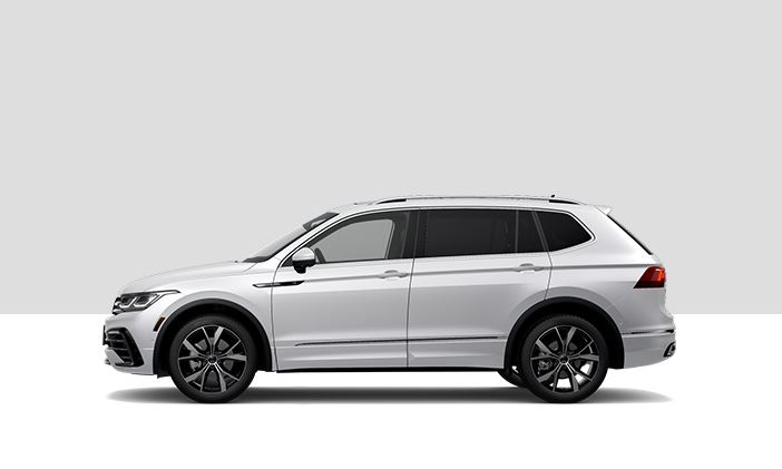 A side profile view of a Volkswagen Tiguan in Oryx White.