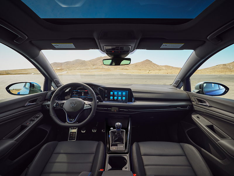 Interior view of a Golf GTI from driver’s perspective showing steering wheel and dash.