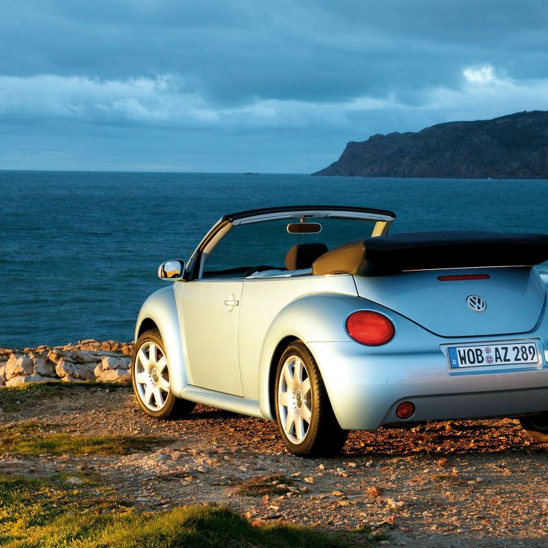 The 2003 Volkswagen New Beetle Convertible parked at an overlook.