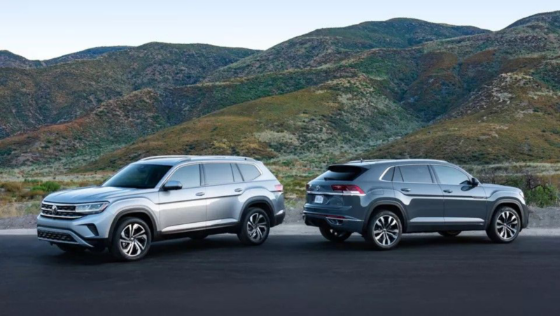 The 2021.5 Atlas and 2020 Atlas Cross Sport parked in front of mountains, showing front 3/4 and rear 3/4 views respectively.