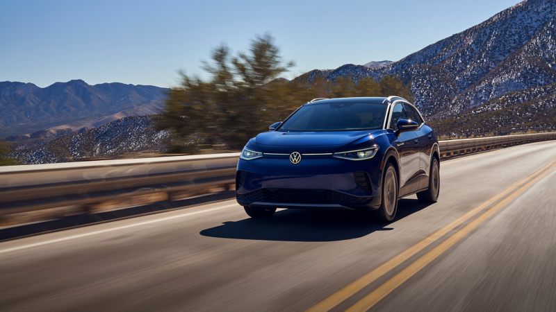 Front ¾ view of the 2021 Volkswagen ID.4 EV driving down the road.