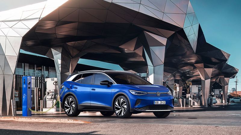 Image shows the 2021 Volkswagen ID.4 being charged from front three-quarter view. 