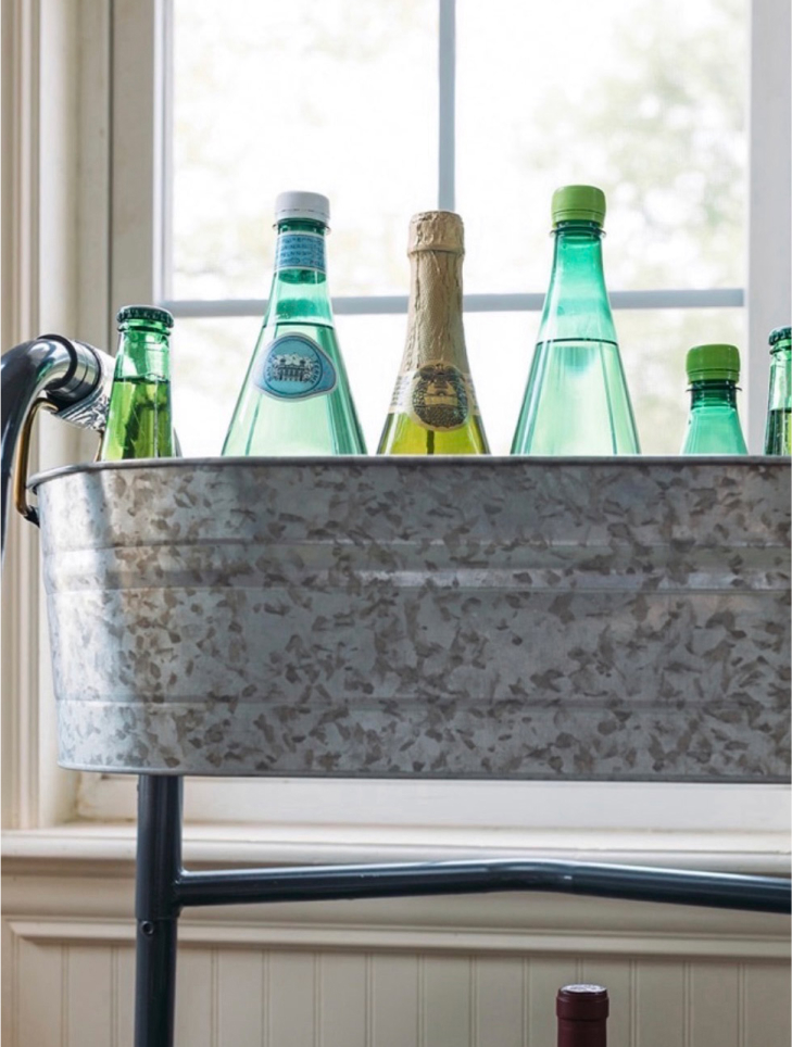 A group of bottles in a container tub.