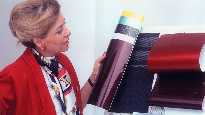 The female designer of the Volkswagen Golf GTI plaid reviews color samples.