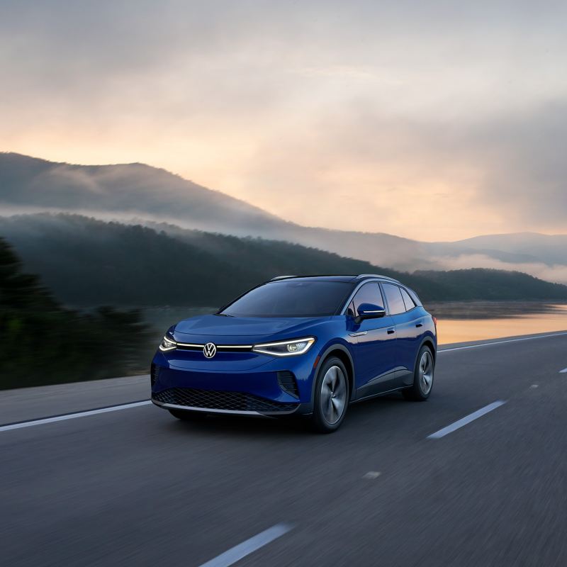 Image shows the 2021 Volkswagen ID.4 being driven, with a rear view of the vehicle. 