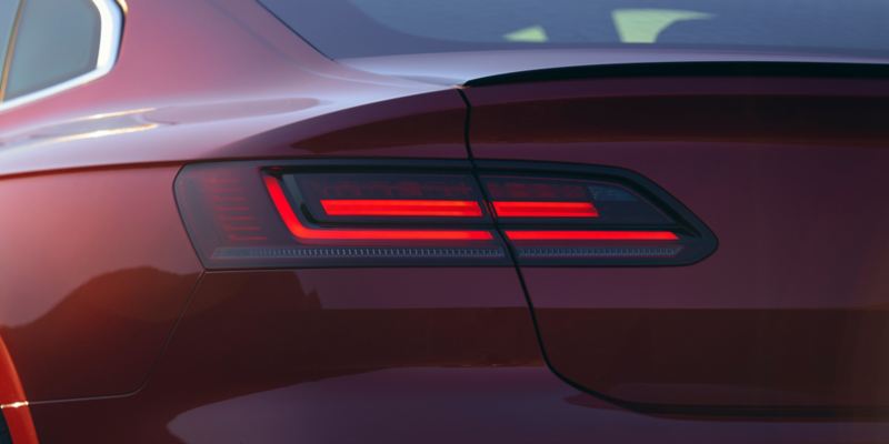 Close-up of the driver side LED tail light on an Arteon shown in Kings Red Metallic.