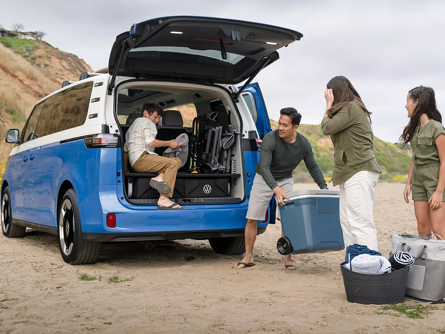 Family loading Volkswagen EV trunk