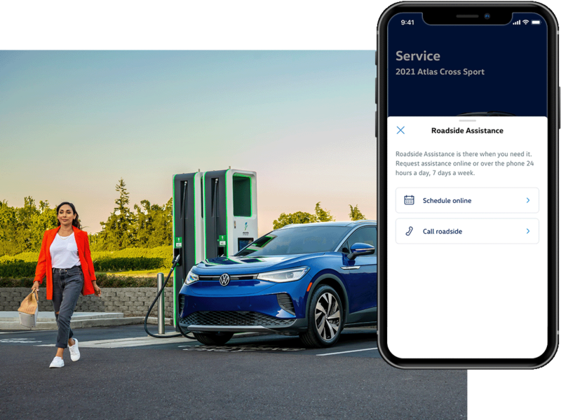 Street level shot of a woman walking towards a parked ID.4 in Dusk Blue Metallic. The MyVW app is displayed on a superimposed mobile phone.
