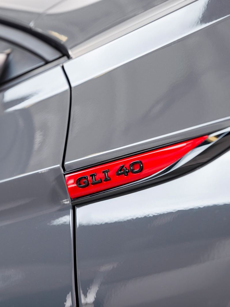 Up close view of the badging of the Jetta GLI shown in Pure Gray.