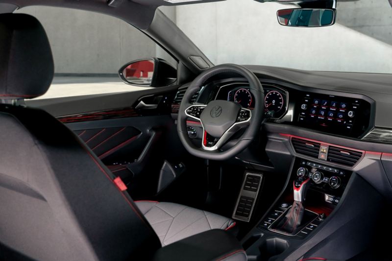 Interior view of the Jetta GLI as shown in molecular cloth showing the driver area as seen from the second row behind the front passenger seat.