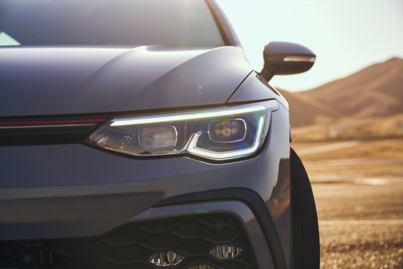 Close up view showing the illuminated LED Daytime Running Lights of a Golf GTI headlight.