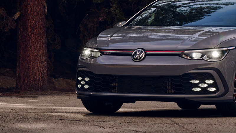 View showing headlights and grille of a Golf GTI shown in Moonstone Gray.