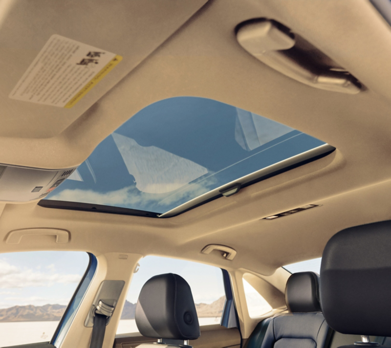 Interior view of a Jetta looking up through the available sunroof.