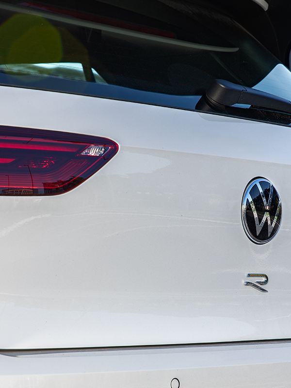 Close up view of the rear hatch of a Golf R shown in Pure White.