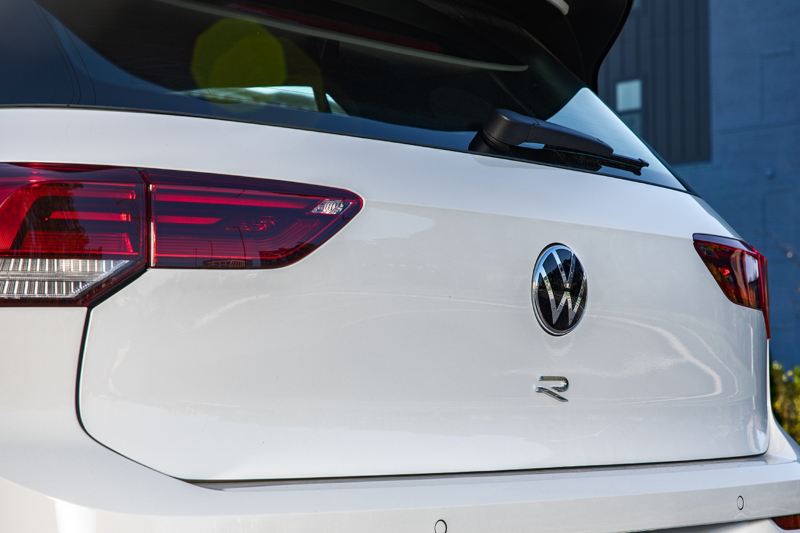 Close up view of the rear hatch of a Golf R shown in Pure White.